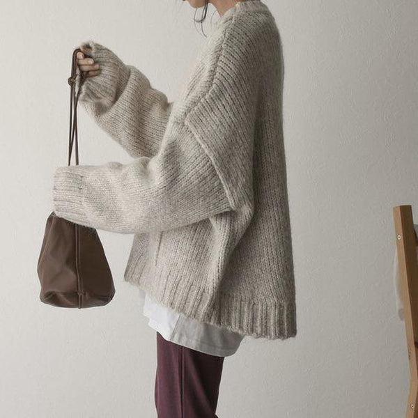 Pull oversize avec poches et coupe ample de couleur claire